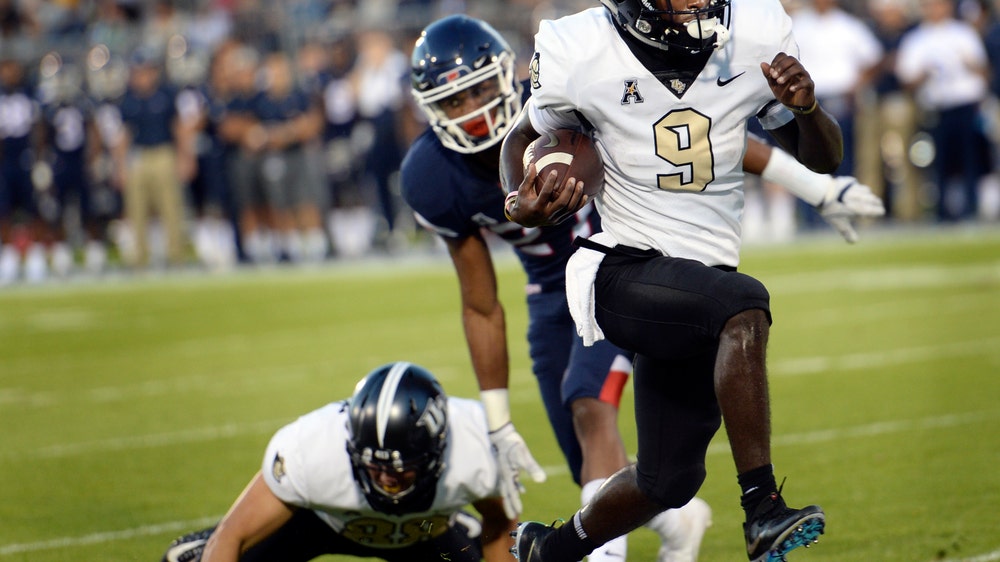 No. 21 UCF extends winning streak to 14 with rout of UConn