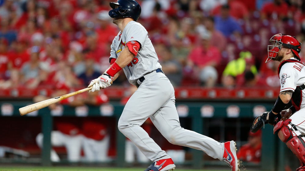 Cardinals take over first place with 13-4 romp over Reds