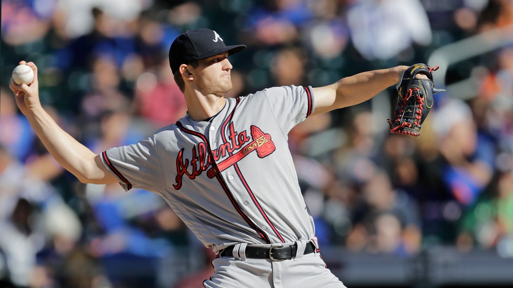 Braves limp into playoffs with 11-inning loss to Mets