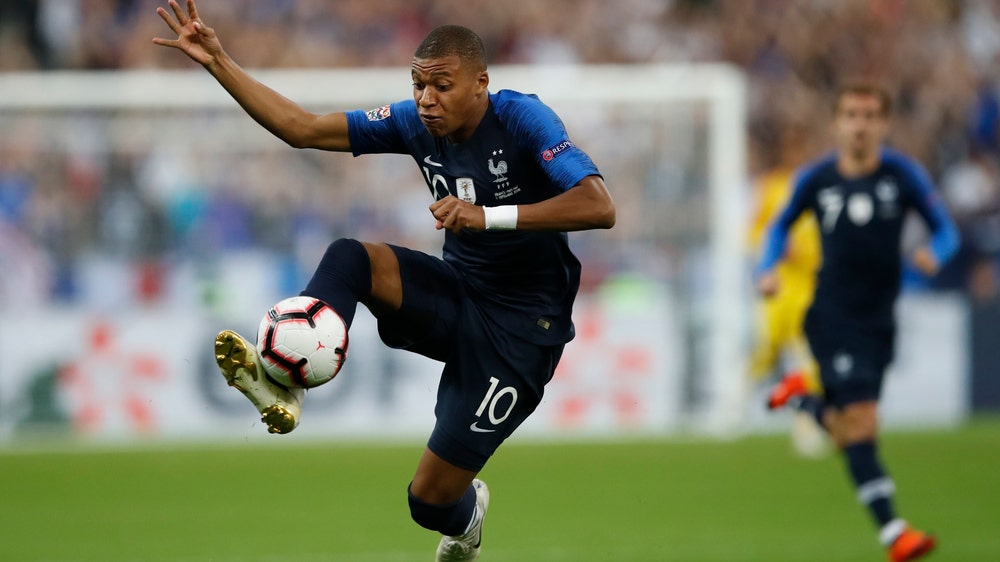 Mbappe, Giroud score as France makes successful return home