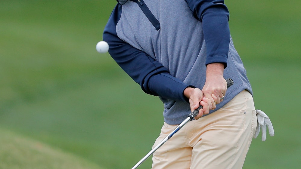 McIlroy emerges from wild day to win Players Championship