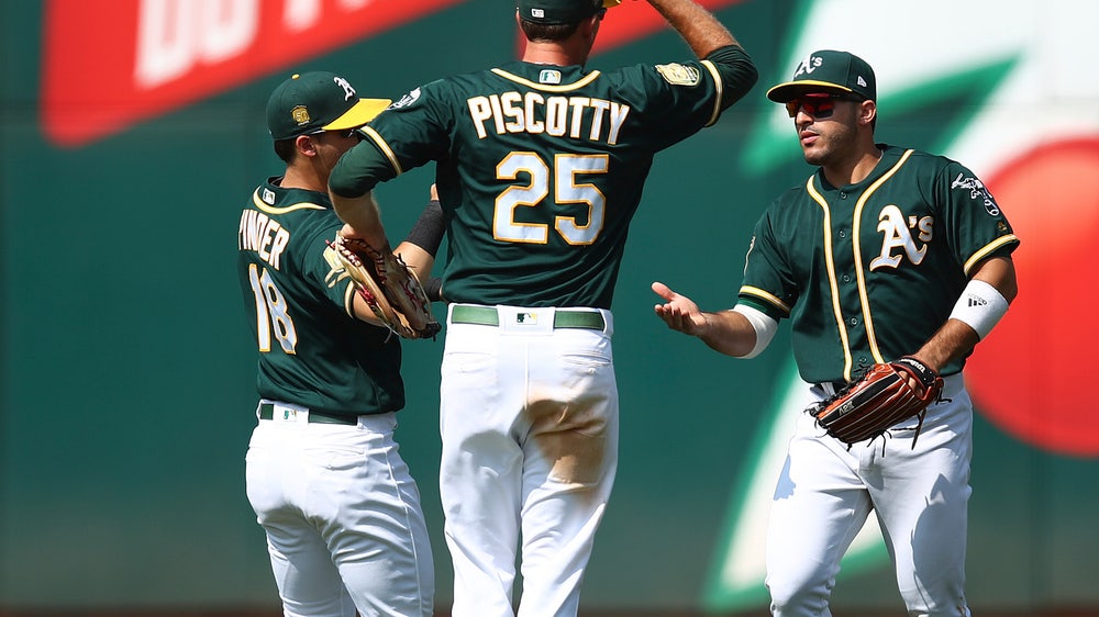 Athletics beat Astros 7-1 to move into tie for AL West lead