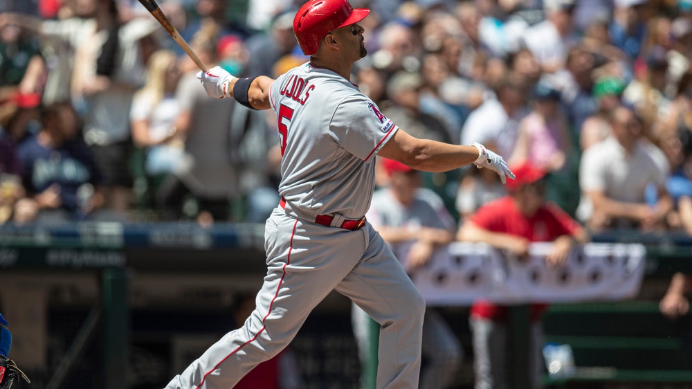 Pujols HR, Suarez wins in debut, Angels rout Mariners 13-3