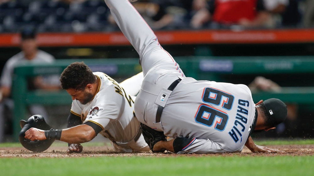 Rojas, Cooper late homers help Marlins end record road skid