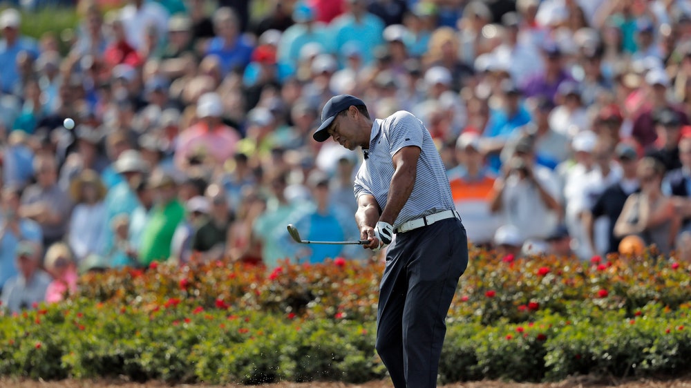 Woods cards highest score ever at 17, makes cut at Players
