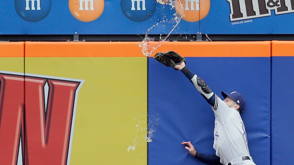 Cheers! Mets fan dumps beer on Brewers’ Braun on near-HR