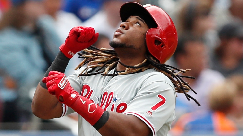 Phils hit 3 HRs, outlast Mets 10-7 to tighten wild-card race