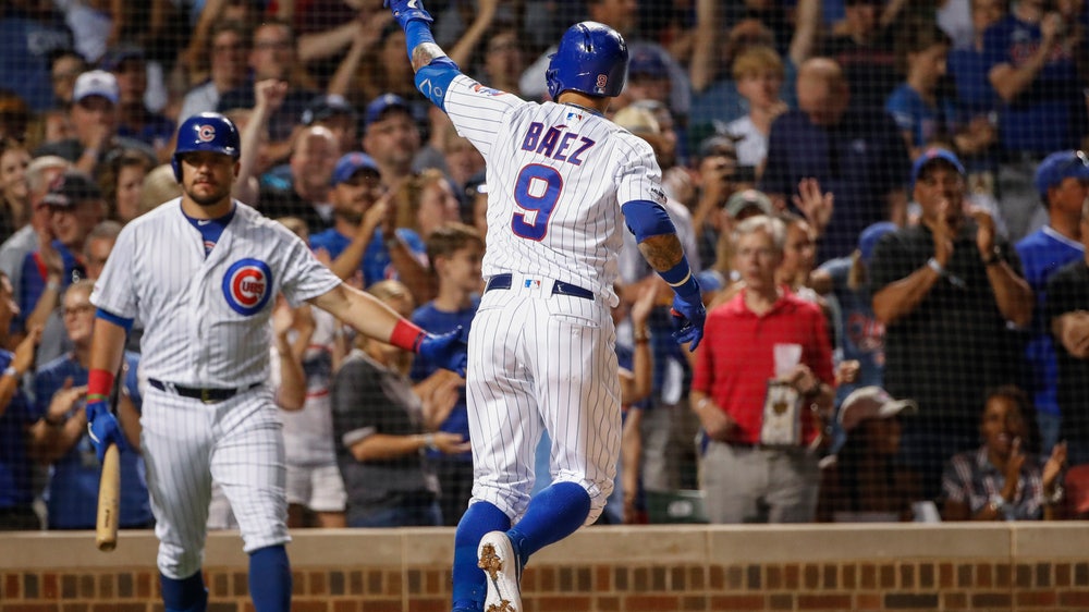 Cubs hold off A's for wild 6-5 win