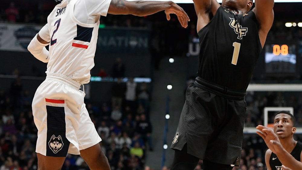 Dawkins scores 13 points and UCF beats UConn on the road