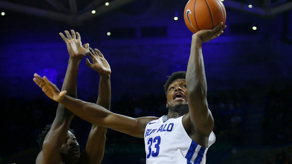 Massinburg leads No. 16 Buffalo past E. Michigan, 77-65
