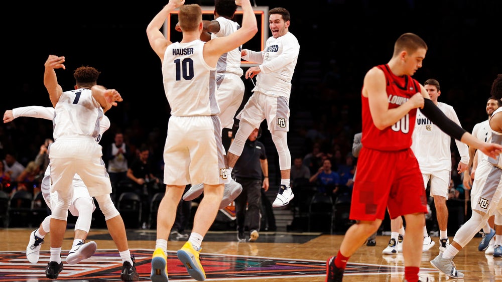 Howard leads Marquette past Louisville in NIT Season Tip-Off