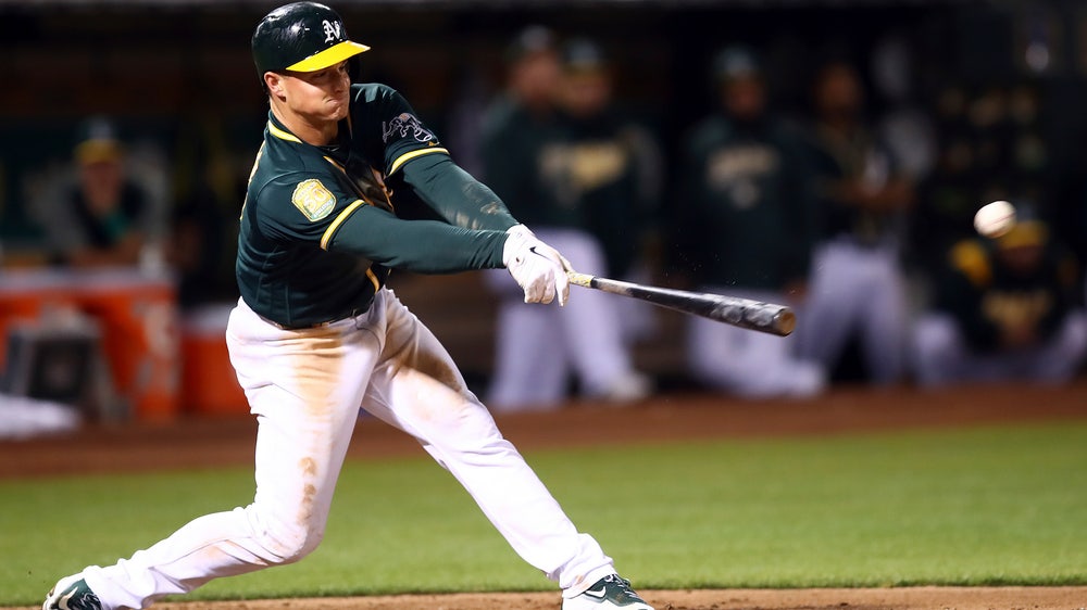 Lowrie drives in 4 to back Manaea, A’s hold off Mariners 7-6