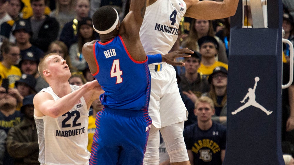 Howard scores 23 as No. 12 Marquette holds off DePaul 79-69