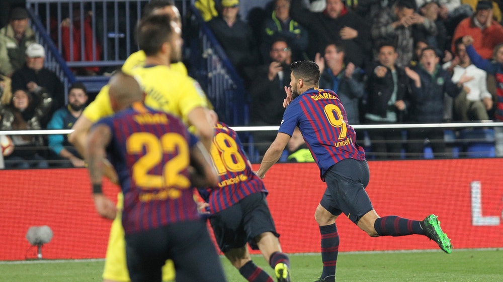 Atletico beats Girona to stay in striking distance of Barca