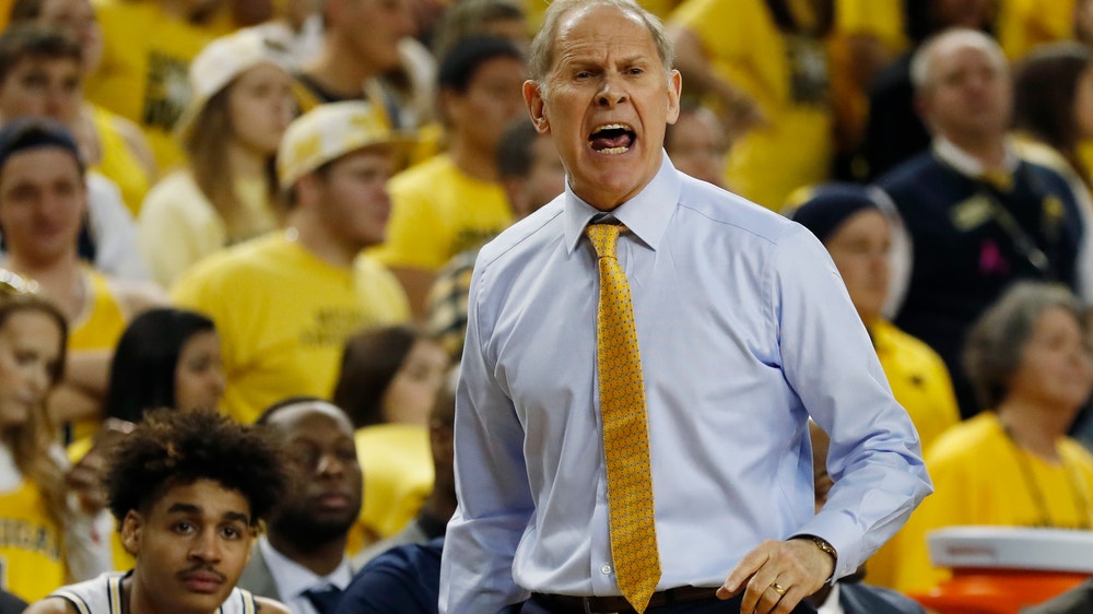 No. 7 Michigan outlasts No. 19 Wisconsin 61-52