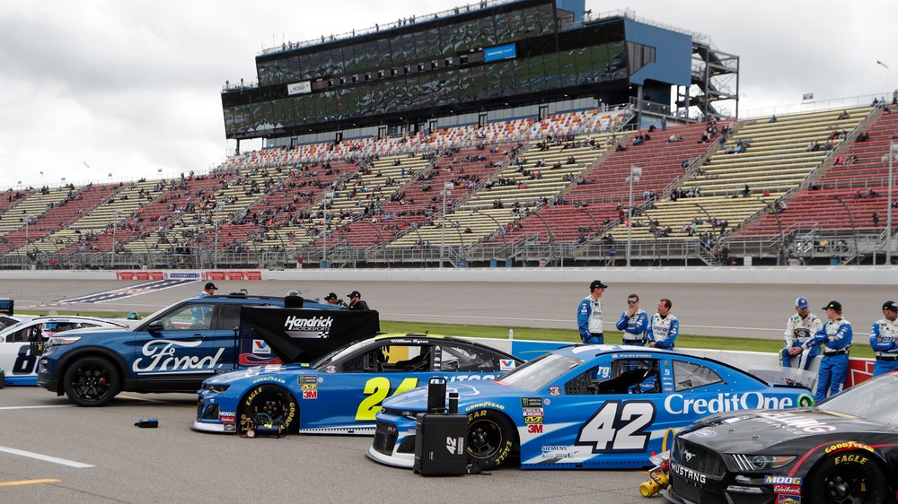 The Latest: Logano edges Kurt Busch, Truex in overtime