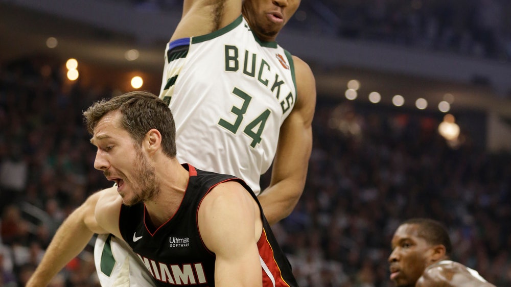 Heat spoil Bucks' home opener, rally to 131-126 win in OT