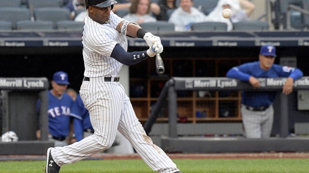 Chapman, Yankees weather heavy rain, hold off Rangers 5-3