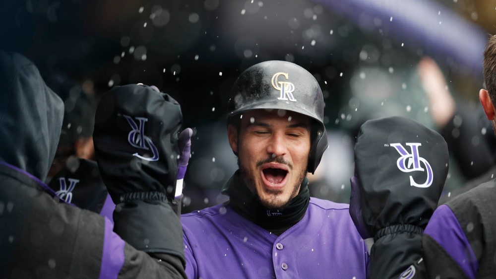 Arenado homers as Rockies outlast Giants, 12-11