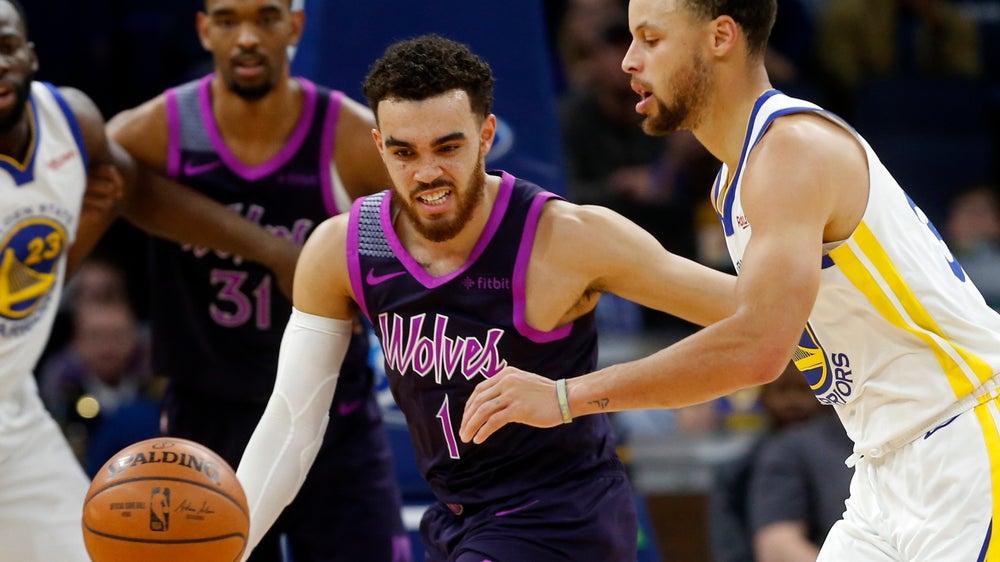 Curry leads Warriors past Wolves 117-107, into 1st in West