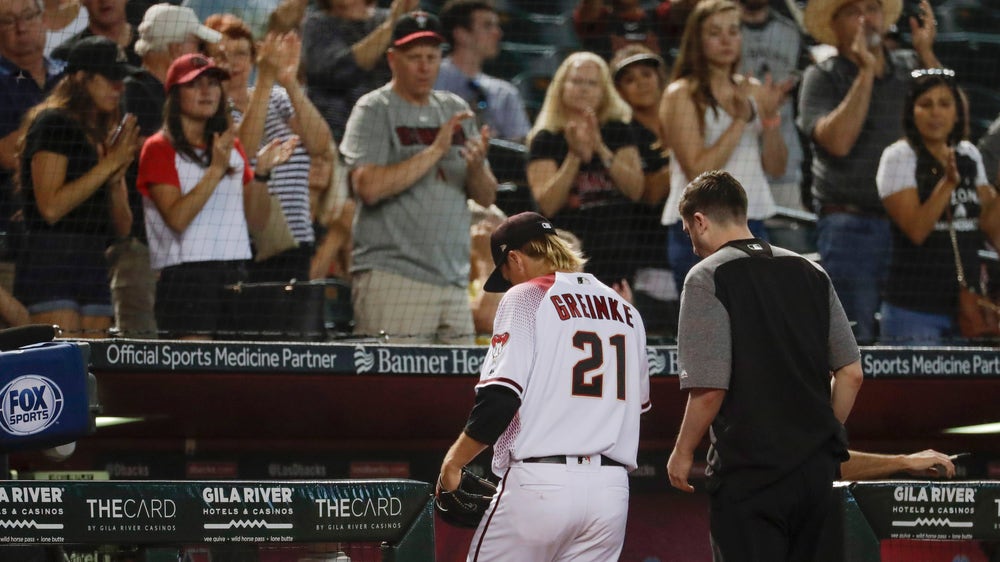 Greinke stars, then exits with trainer, D-backs rout Pirates