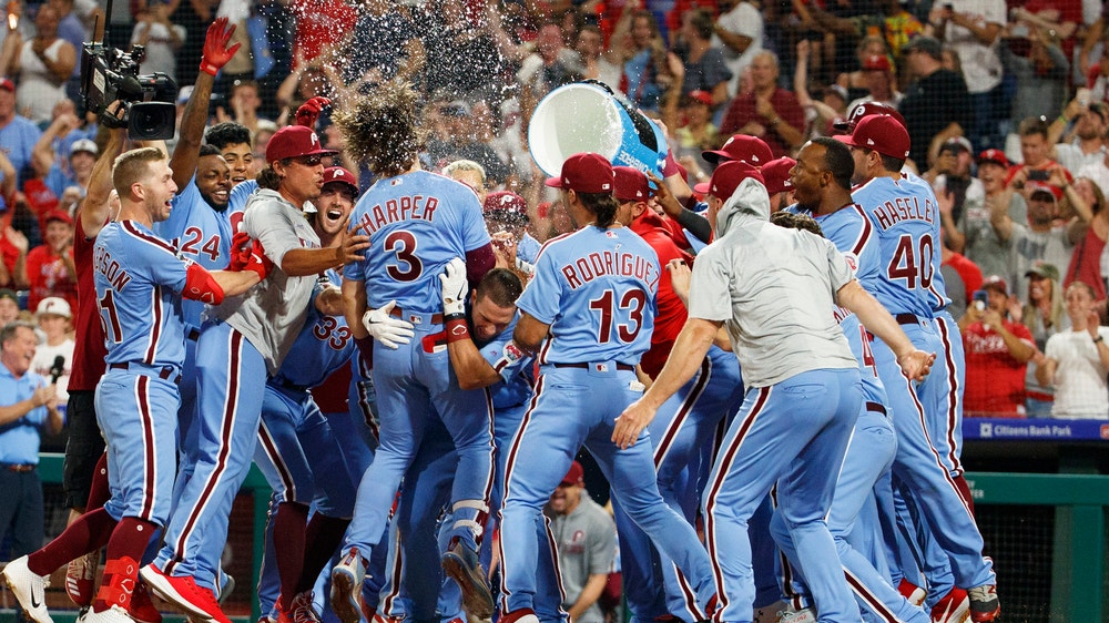 Harper hits grand slam in 9th, Phillies rally past Cubs 7-5
