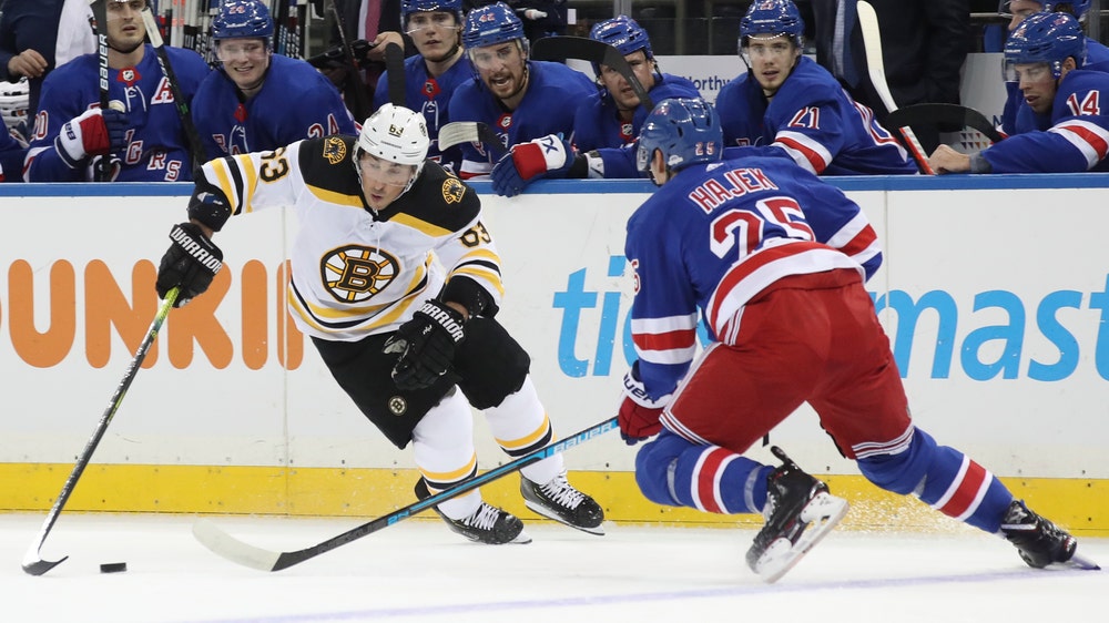 Marchand, Bergeron lead Bruins to 7-4 win over Rangers