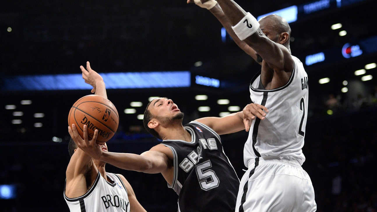 Nets pull away to beat short-handed Spurs