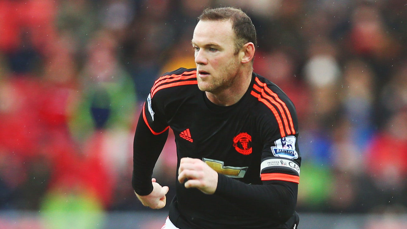 Wayne Rooney plays with tigers and giraffes while in Dubai