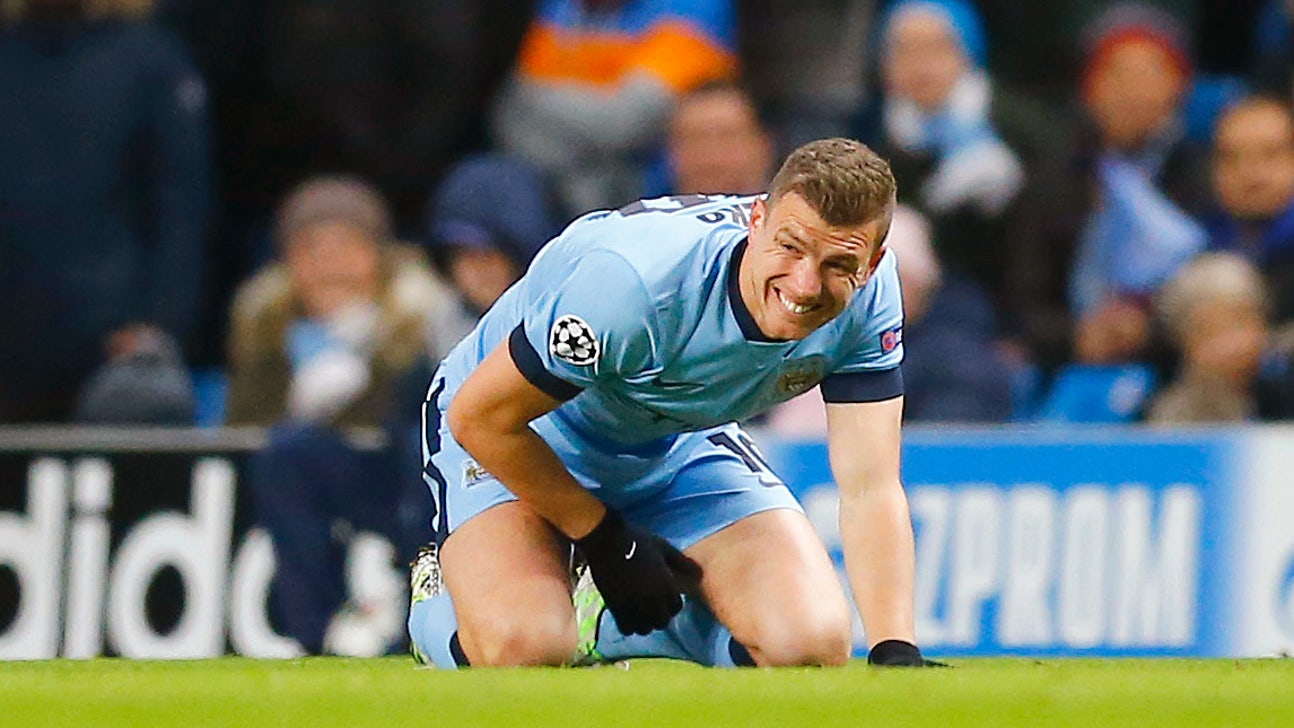 That's gotta hurt! City's Dzeko gets drilled during match vs. Barca