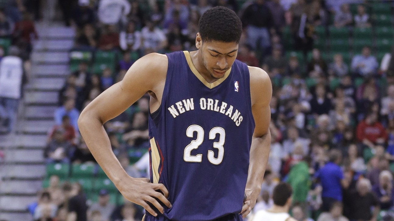 Pelicans treating Davis' back spasms with dry needling