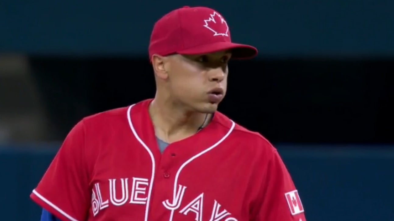 Blue Jays 2B Ryan Goins throws perhaps the worst warm-up pitch ever