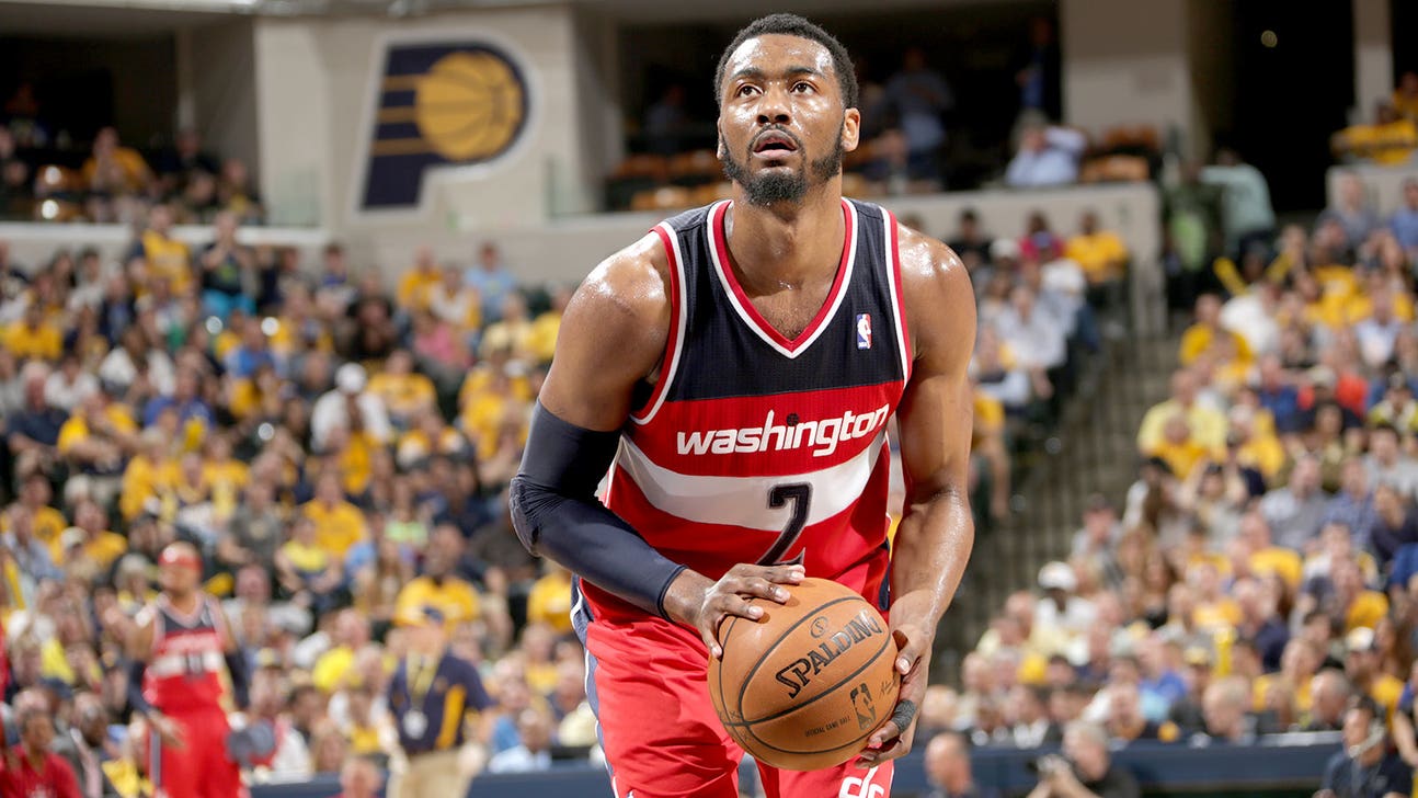 John Wall shows off 'Great Wall' tattoo while sitting on Great Wall of China