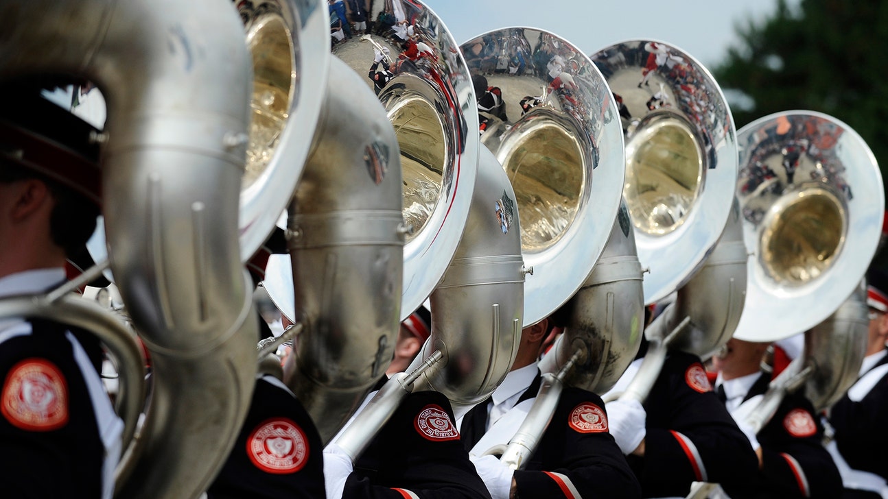 Fired Ohio State band director cries playing alma mater in alumni band