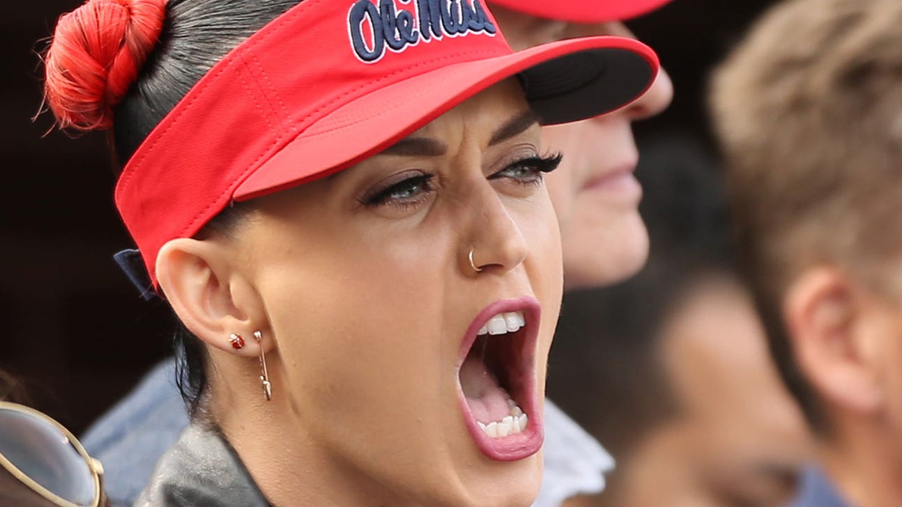 Katy Perry chugs beer, jumps off bar in moment of pure bliss