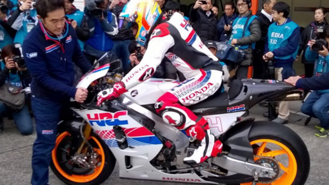 Fernando Alonso gets up to speed on MotoGP bike