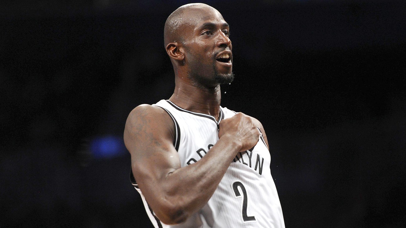 Kevin Garnett helps bring cheer to children at holiday charity event
