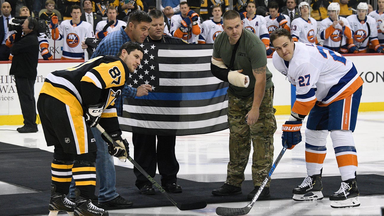 Penguins honor shooting victims with ceremony, special logo