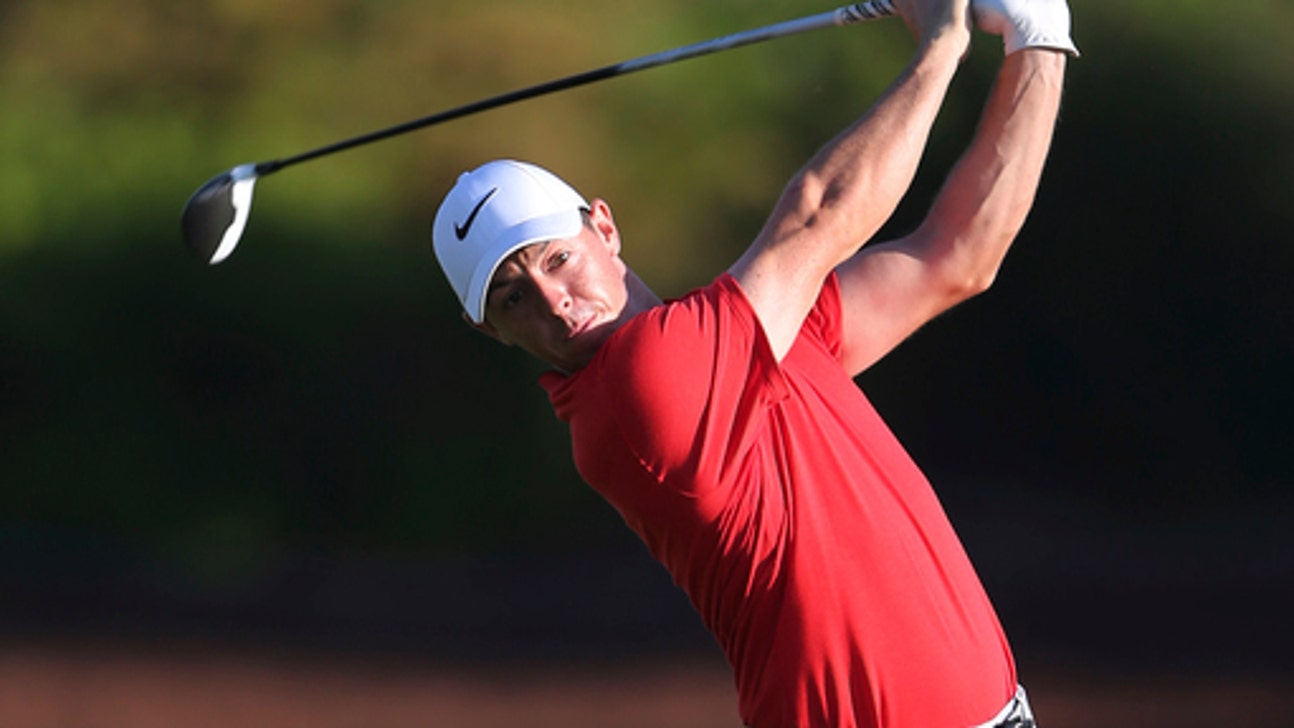 McIlroy hurts his back, finishes round at SA Open