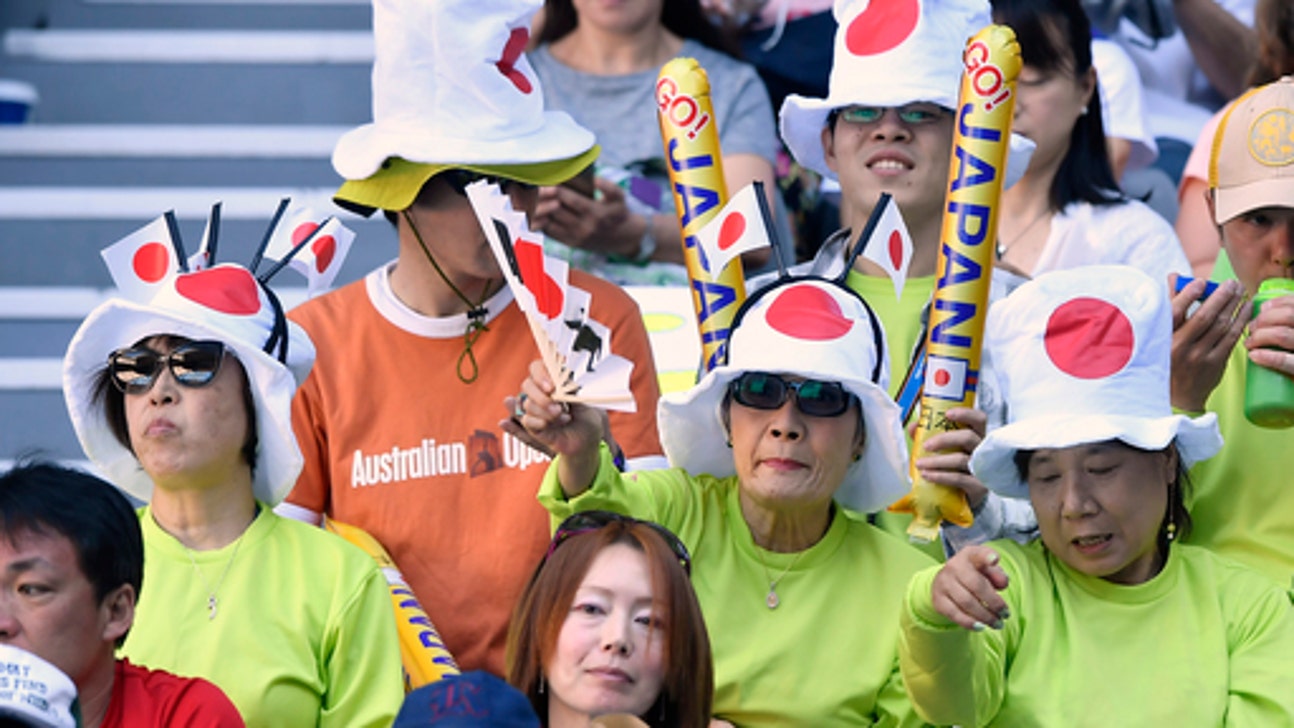 The Latest: Destanee makes history at Australian Open