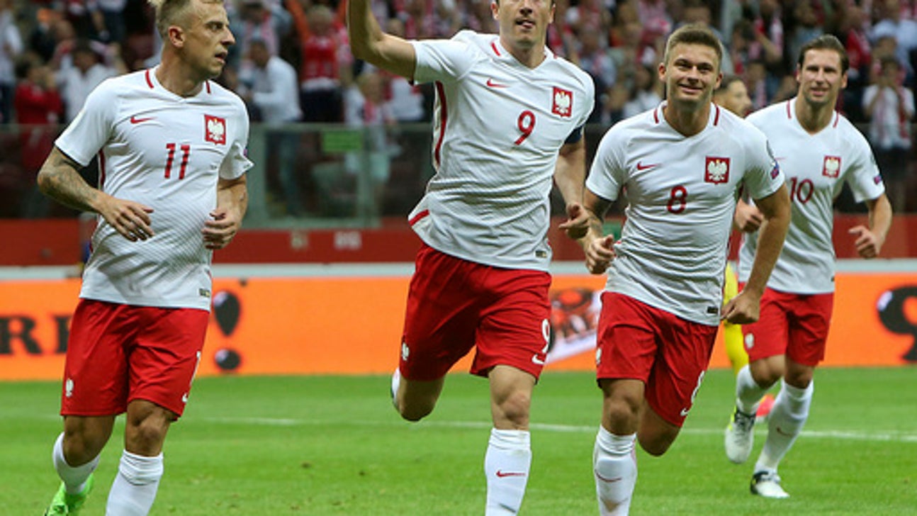 Lewandowski hat trick keeps Poland on course for World Cup