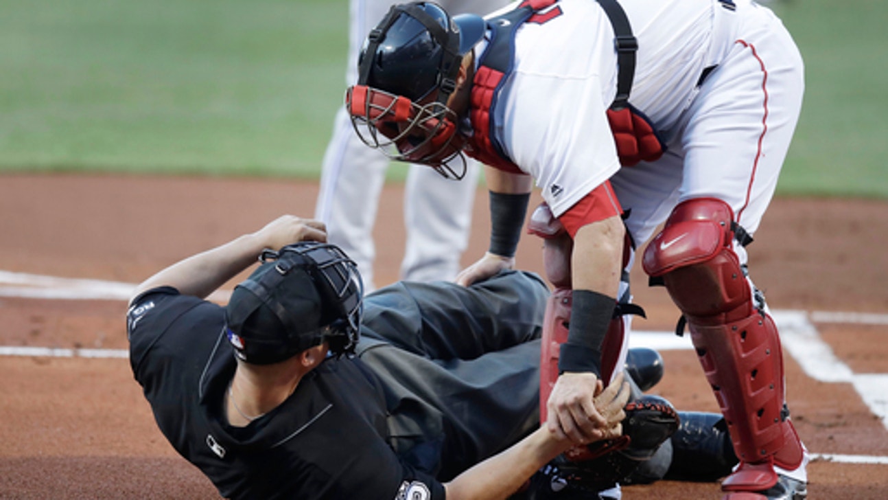 Home plate umpire Chris Segal hit by Josh Donaldson's bat