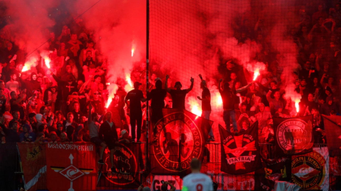 Flare lands near referee in Champions League game