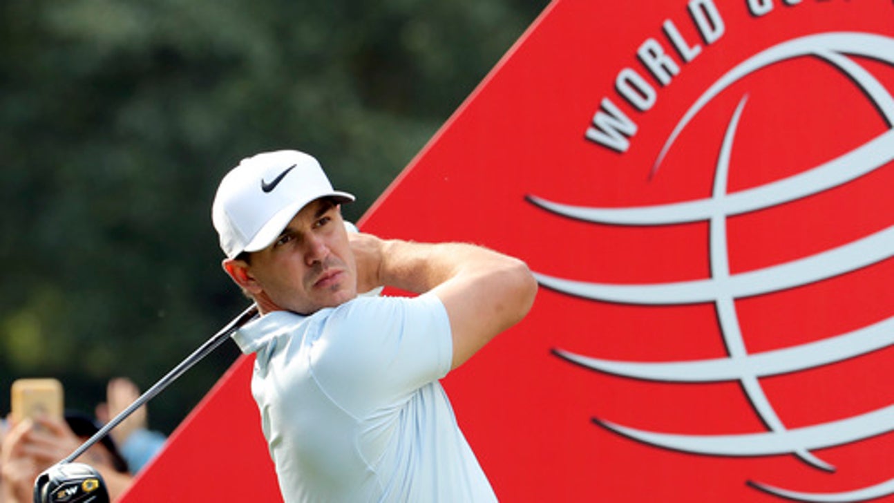 Johnson shoots 63 with new putter for lead at HSBC Champions