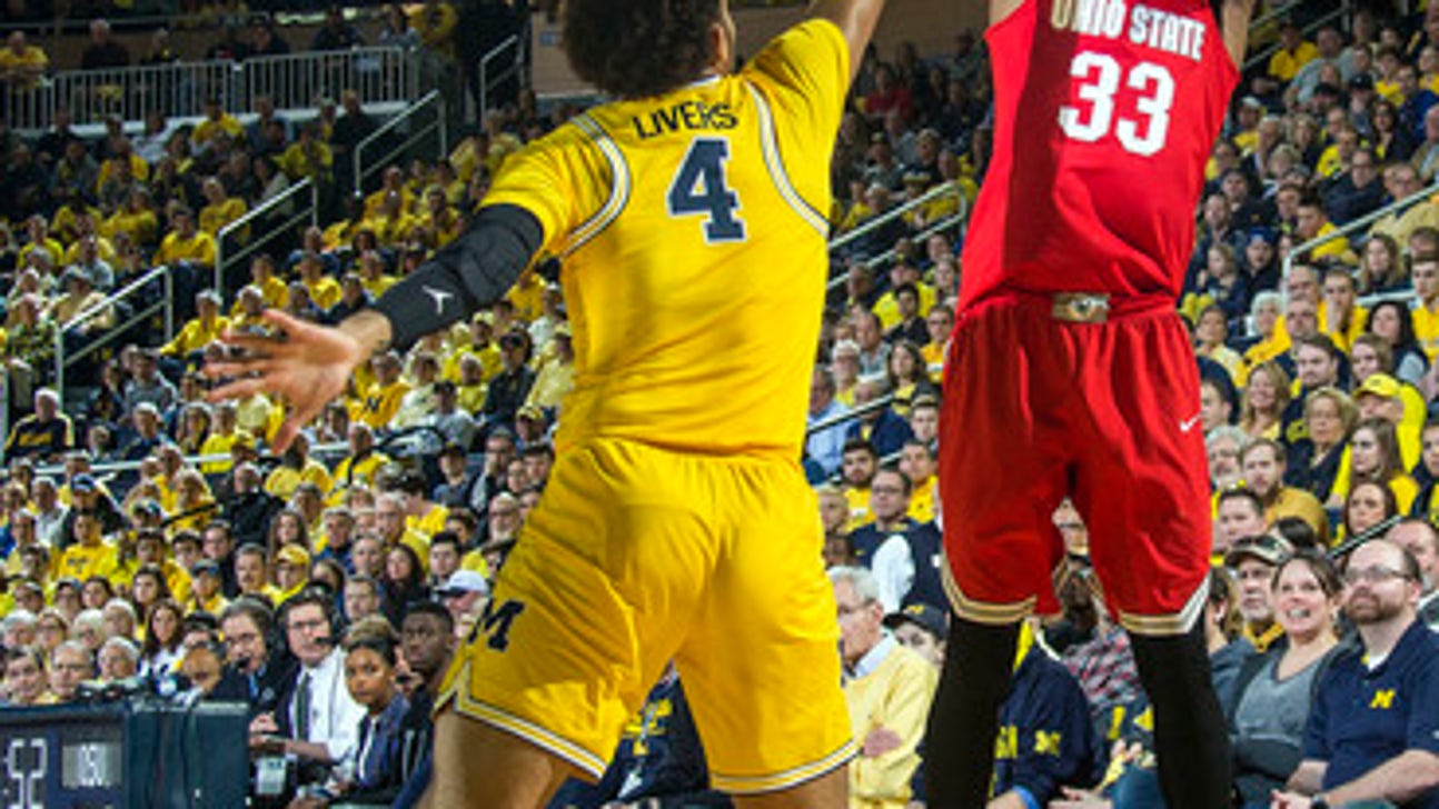 No. 22 Michigan tops No. 8 Ohio St 74-62, helps other rival