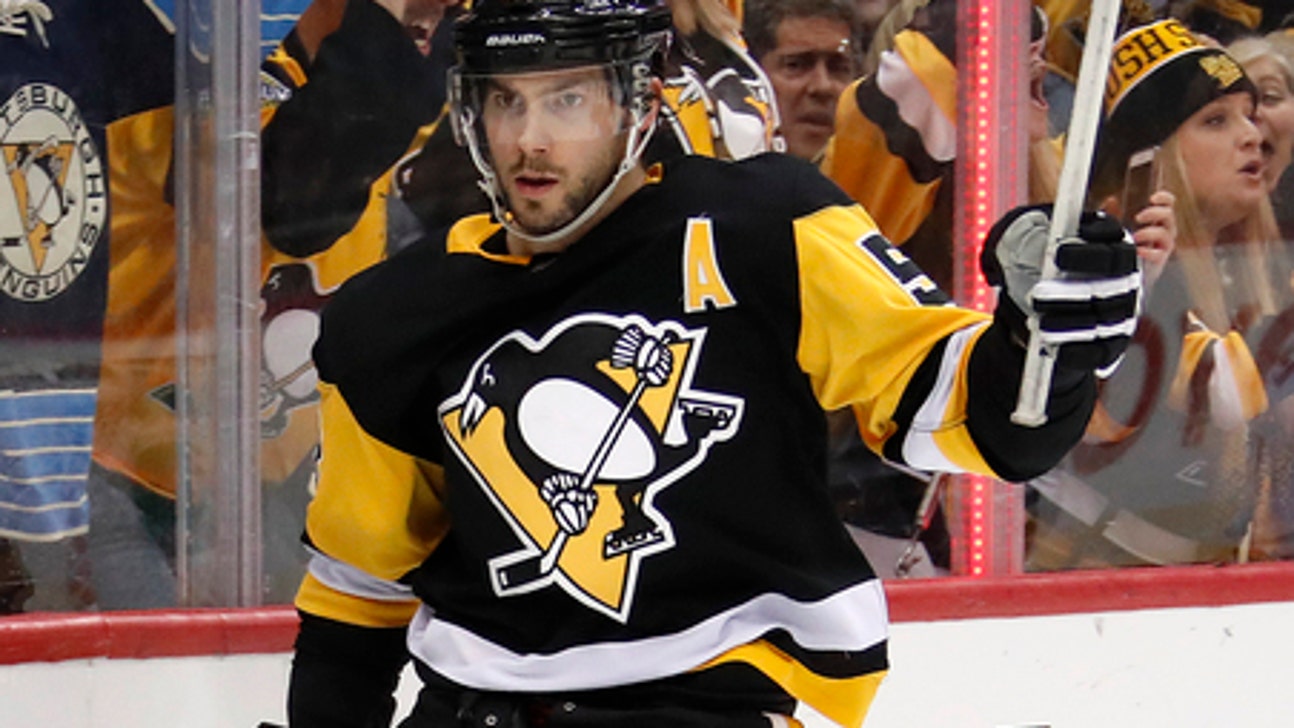 Schultz’s OT goal lifts Penguins past Flames 4-3