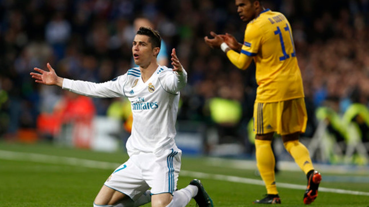 Late Ronaldo penalty keeps Madrid alive in Champions League