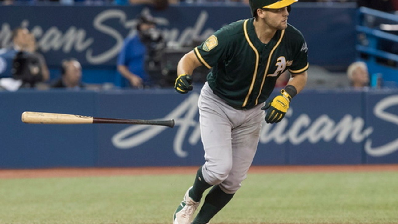 Pinder hits grand slam, A’s get 5 in 8th, beat Blue Jays 5-4