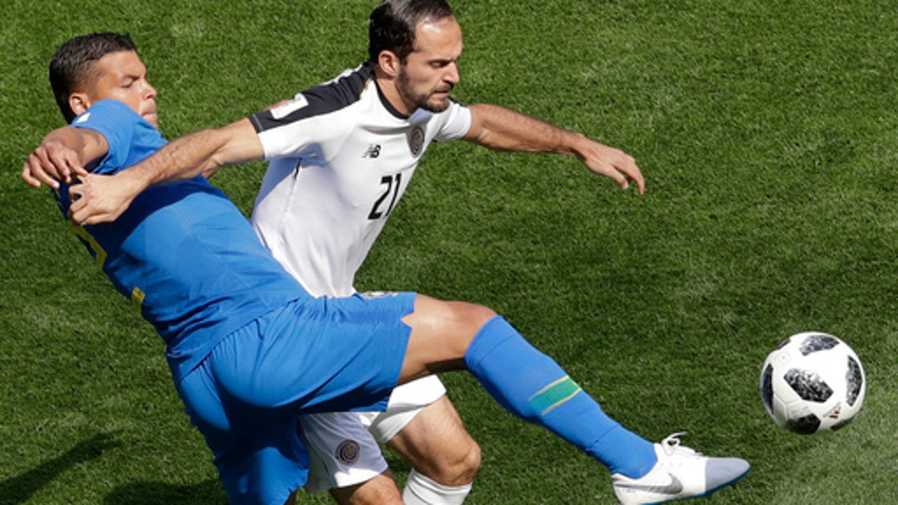AP PHOTOS: Brazil leaves it late on Day 9 of World Cup