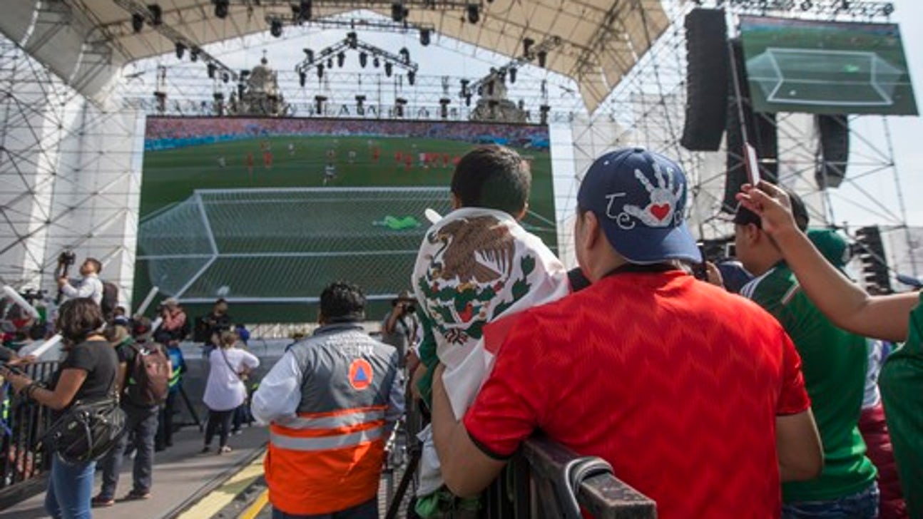 Mexican soccer fans and pride marchers mingle in celebration